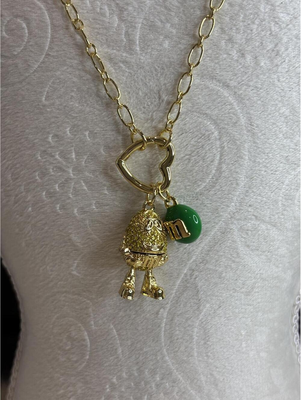 Kate Spade Gold Tone M&M Pendant Necklace with Green Charm